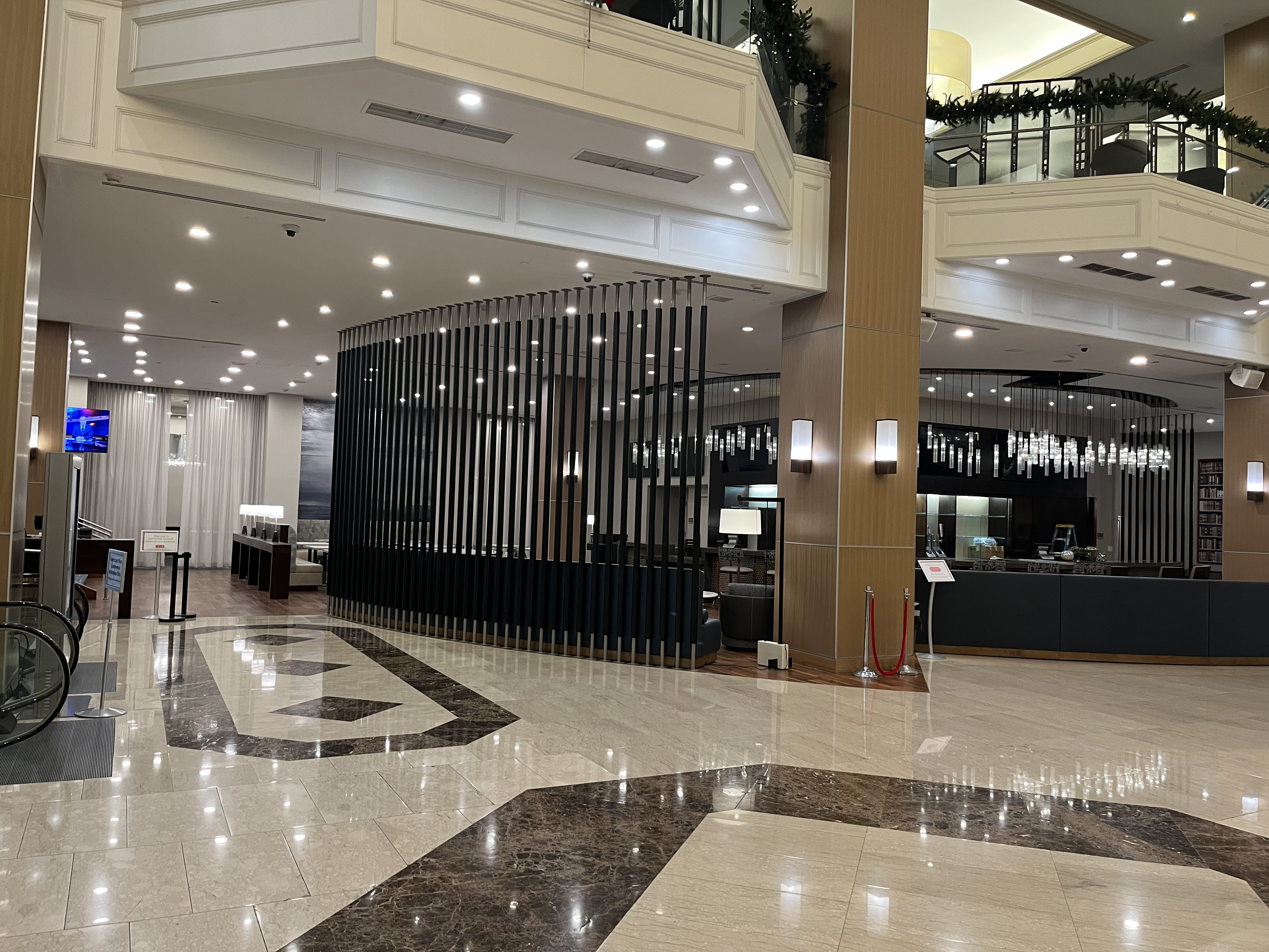 Custom metal bar divider in hotel lobby by Alabama Metal Art.